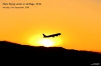 Plane flying sunset in Santiago, Chile